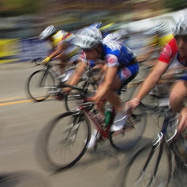 men in a bicycle race with motion blur